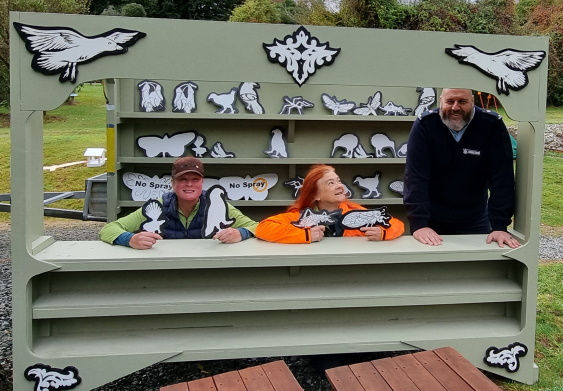 (L-R): DOC Biodiversity Rangers Jen Haslam and Catherine Brimecombe, with the Invercargill Prison industries Manager Barry, testing out the new play centre, during installation.