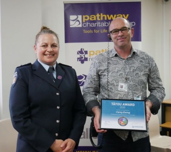 Prison Director Jo Harrex presented an award to Pathway Reintegration Manager Carey Ewing, who has been the driving force behind the Navigate Initiative partnership. 