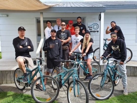 Tanima and Darell (back row left) presented Live for More staff and participants with bikes painted in the Live for More signature teal. 