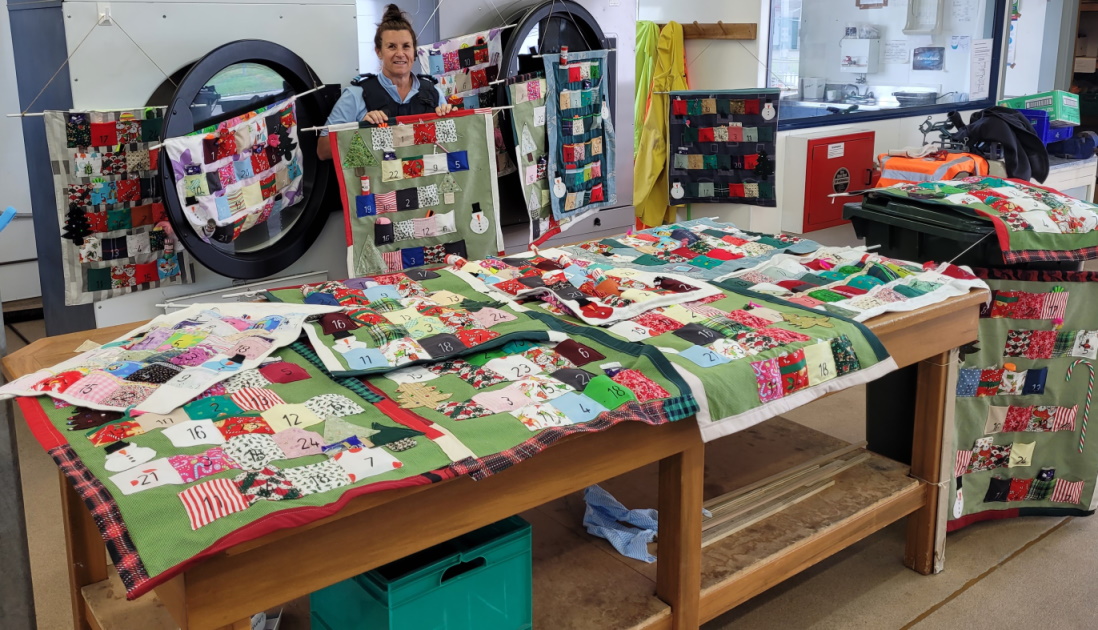 Instructor Cheryl with some of the advent calendars made at Hawke's Bay Regional Prison.