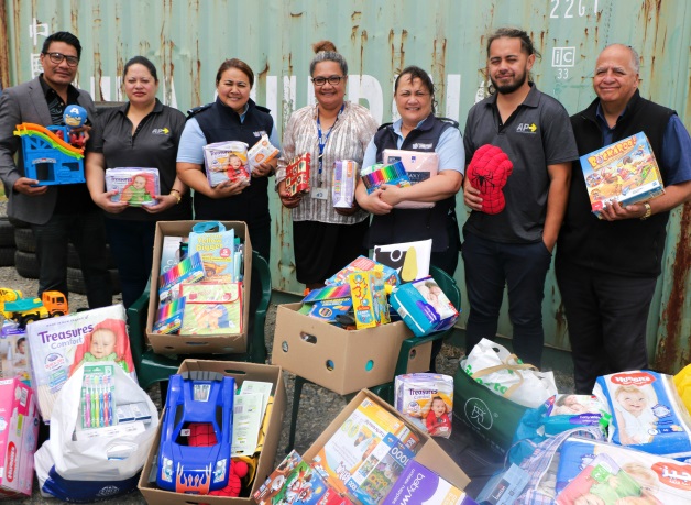 Corrections staff with donated good bound for families affected by the measles outbreak in Samoa.